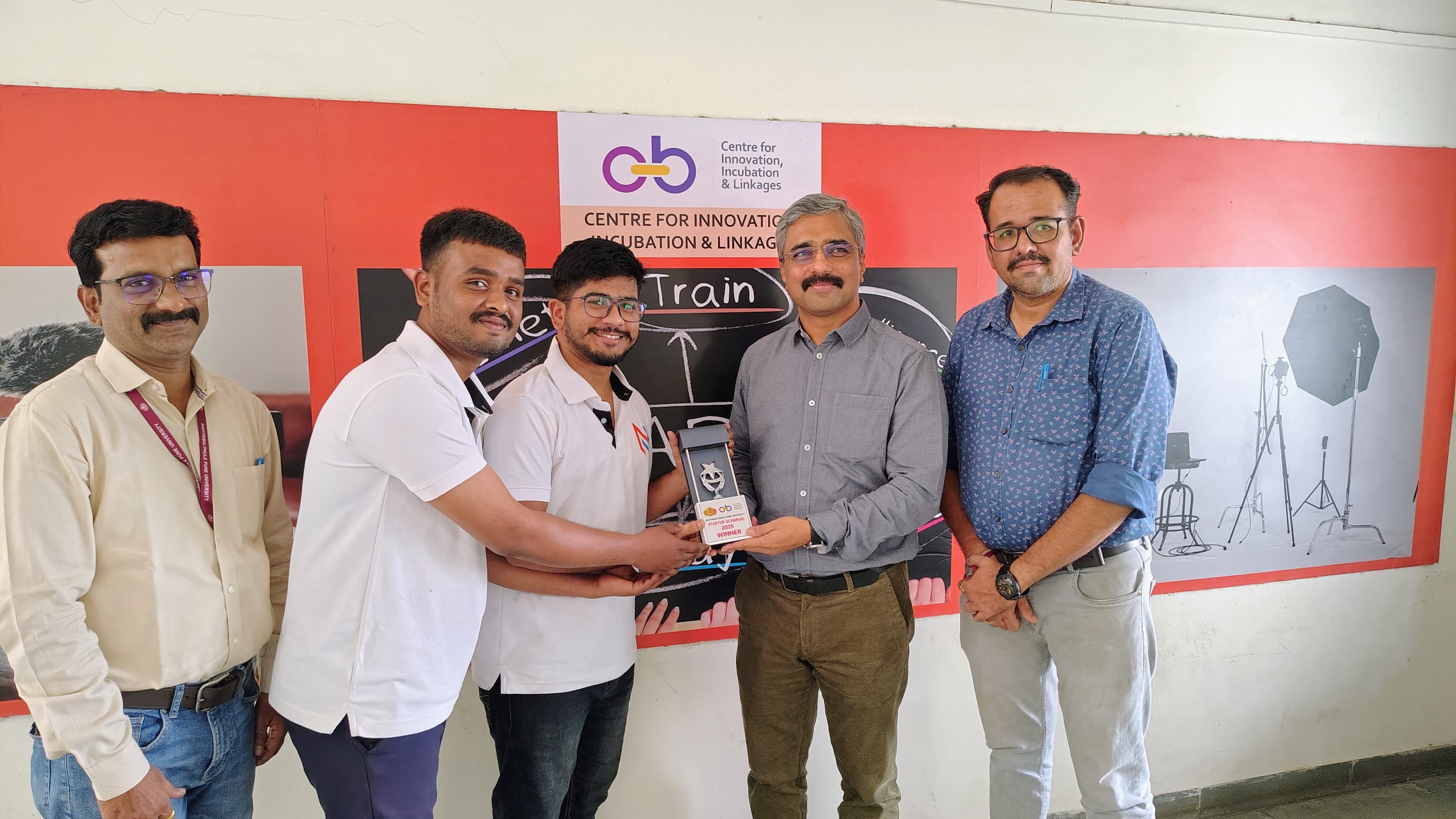 NaviByte Innovations team receiving SPPU Startup Olympiad award - Photo 1